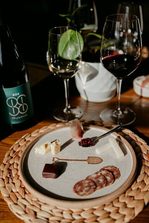 Elegant wine tasting experience with cheese and charcuterie pairing, perfect for "Tasting Experiences" at Bos Wine.